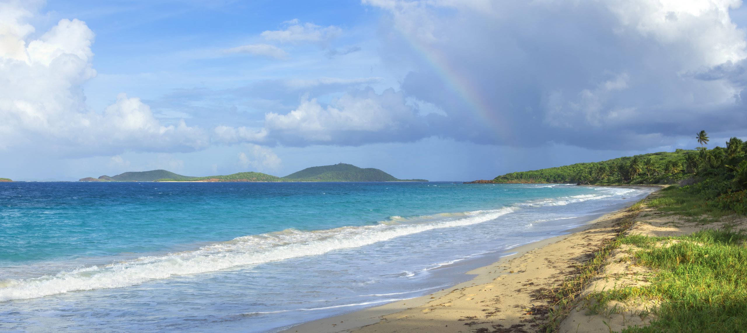 Rainbow over Caribbean island beach